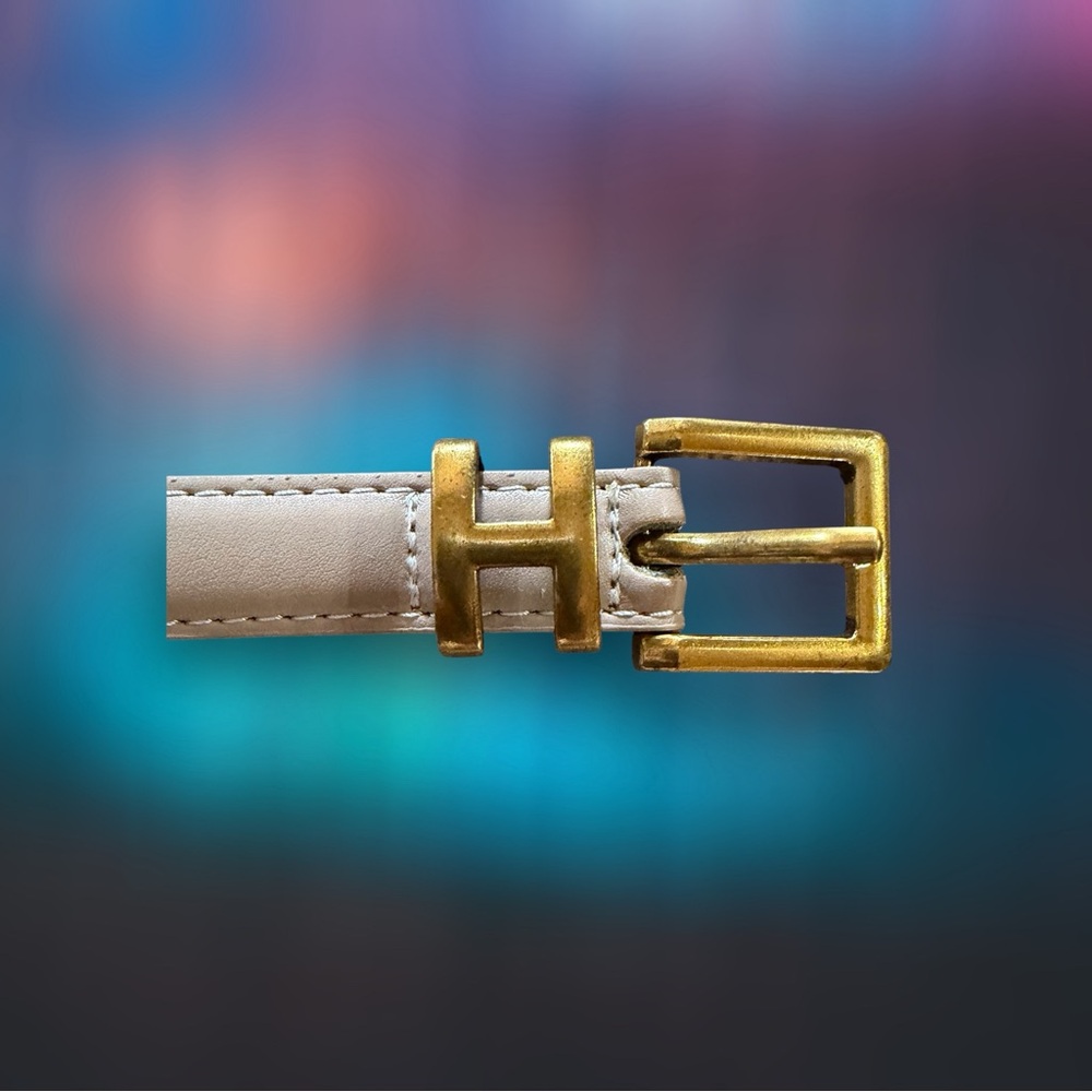 New w/o tags. Gold Buckle in a letter H. Beige Belt. 37” long.